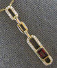 .96CT DIAMOND & AAA GARNET 14KT YELLOW GOLD 3D EMERALD CUT & ROUND LOVE NECKLACE