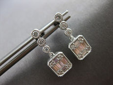 ESTATE .45CT DIAMOND 14KT WHITE GOLD ROUND & BAGUETTE INVISIBLE HANGING EARRINGS
