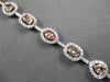 LARGE GIA 6.56CT MULTI COLOR DIAMOND 18KT WHITE & ROSE GOLD HALO TENNIS BRACELET