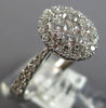 .82CT DIAMOND 18KT WHITE GOLD 3D CLASSIC ROUND CLUSTER HALO OVAL FRIENDSHIP RING