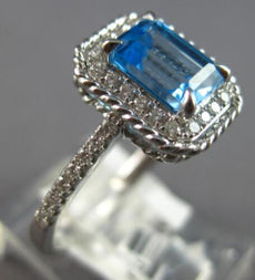 1.44CT DIAMOND & AAA BLUE TOPAZ 14KT WHITE GOLD 3D EMERALD CUT & ROUND HALO RING