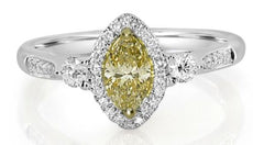 .88CT WHITE & FANCY YELLOW DIAMOND 18KT 2 TONE GOLD 3 STONE HALO ENGAGEMENT RING