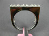 ESTATE .60CT DIAMOND 18KT WHITE GOLD ROUND & PRINCESS INVISIBLE ANNIVERSARY RING