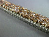 WIDE 22.84CT WHITE & PINK DIAMOND 18KT WHITE & ROSE GOLD CLUSTER TENNIS BRACELET