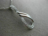 ESTATE .03CT DIAMOND 14KT WHITE GOLD 3D LOVE KNOT SEMI INFINITY FLOATING PENDANT
