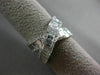 ESTATE 1.12CT ROUND & BAGUETTE DIAMOND 18KT WHITE GOLD CRISS CROSS INFINITY RING