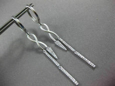 ESTATE LONG .28CT DIAMOND 14KT WHITE GOLD INFINITY LOVE HUGGIE HANGING EARRINGS