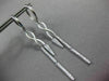 ESTATE LONG .28CT DIAMOND 14KT WHITE GOLD INFINITY LOVE HUGGIE HANGING EARRINGS