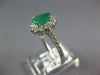 1.41CT DIAMOND & AAA EMERALD 14KT WHITE GOLD OVAL & ROUND FLOWER ENGAGEMENT RING