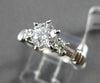 ESTATE 1.12CT ROUND & BAGUETTE DIAMOND 14KT WHITE GOLD SOLITAIRE ENGAGEMENT RING