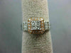 WIDE .50CT ROUND & BAGUETTE DIAMOND 14KT WHITE & ROSE GOLD HALO ENGAGEMENT RING