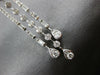 LONG 1.25CT DIAMOND 14KT WHITE GOLD ROUND & BAGUETTE HORSESHOE HANGING EARRINGS