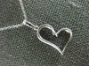ESTATE .20CT DIAMOND 18KT WHITE GOLD 3D SIDEWAYS HEART FLOATING LOVE PENDANT