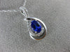 ESTATE .63CT DIAMOND & AAA TANZANITE 14KT WHITE GOLD OVAL INFINITY LOVE PENDANT