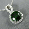 ESTATE 1.20CT DIAMOND & AAA GREEN GARNET 14KT WHITE GOLD ROUND INFINITY PENDANT