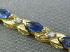 ESTATE 1.21CT DIAMOND & AAA MARQUISE SAPPHIRE 14KT TWO TONE GOLD X LOVE BRACELET