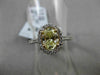 ESTATE 1.32CT GIA FANCY YELLOW DIAMOND 18KT WHITE GOLD OVAL HALO ENGAGEMENT RING