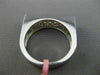 ESTATE .60CT ROUND & PRINCESS DIAMOND 18KT WHITE GOLD RECTANGULAR INVISIBLE RING