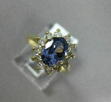 1.83CT DIAMOND & AAA OVAL TANZANITE 14KT YELLOW GOLD FLOWER HALO ENGAGEMENT RING