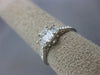 ESTATE .82CT DIAMOND PLATINUM THREE STONE EMERALD CUT FILIGREE ENGAGEMENT RING