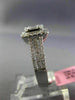 ESTATE LARGE .66CT ROUND & BAGUETTE DIAMOND 18KT WHITE GOLD HALO ENGAGEMENT RING