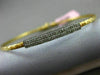ESTATE .15CT DIAMOND 14KT TWO TONE GOLD ELONGATED PAVE FLEXIBLE BANGLE BRACELET