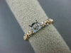 ESTATE .20CT DIAMOND 14KT WHITE & ROSE GOLD OPEN FILIGREE FLOWER ENGAGEMENT RING