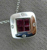 ESTATE .80CT DIAMOND & AAA RUBY 18KT WHITE GOLD SQUARE ETOILE INVISIBLE PENDANT