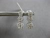 1.0CT DIAMOND 14KT WHITE GOLD 3D MULTI FLOWER JOURNEY SCREWBACK HANGING EARRINGS