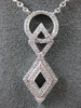 ESTATE .29CT DIAMOND 18KT WHITE GOLD CIRCLE OF LIFE INFINITY LOVE KNOT NECKLACE