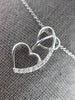 ESTATE .03CT DIAMOND 14KT WHITE GOLD 3D DOUBLE HEART LOVE FLOATING PENDANT