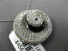 ESTATE LARGE 1.34CT DIAMOND & ONYX 18KT WHITE GOLD SWIRL SHELL FLOATING PENDANT