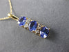 ESTATE 1.06CT DIAMOND & AAA TANZANITE 14KT YELLOW GOLD 3 STONE JOURNEY PENDANT