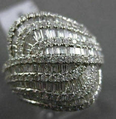 ESTATE 2.15CT BAGUETTE & ROUND DIAMOND 18KT WHITE GOLD INTERTWINNING FUN RING