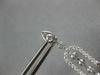 LONG 1.25CT DIAMOND 14KT WHITE GOLD ROUND & BAGUETTE HORSESHOE HANGING EARRINGS
