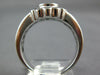 WIDE 2.19CT DIAMOND & EMERALD 18KT WHITE GOLD OVAL ROUND & BAGUETTE FLOWER RING
