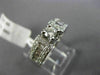 ESTATE .90CT ROUND & BAGUETTE DIAMOND 14KT WHITE GOLD FOUR PRONG ENGAGEMENT RING