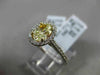 ESTATE 1.32CT GIA FANCY YELLOW DIAMOND 18KT WHITE GOLD OVAL HALO ENGAGEMENT RING