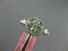 ESTATE .86CT DIAMOND 18KT WHITE GOLD 3D ROUND & PRINCESS FLOWER HALO LOVE RING