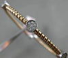 ESTATE .21CT DIAMOND 14KT WHITE & ROSE GOLD PAST PRESENT FUTURE BANGLE BRACELET