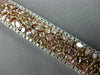 WIDE 22.84CT WHITE & PINK DIAMOND 18KT WHITE & ROSE GOLD CLUSTER TENNIS BRACELET