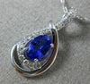 ESTATE .63CT DIAMOND & AAA TANZANITE 14KT WHITE GOLD OVAL INFINITY LOVE PENDANT