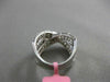 ESTATE 1.12CT ROUND & BAGUETTE DIAMOND 18KT WHITE GOLD CRISS CROSS INFINITY RING