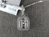ESTATE .49CT DIAMOND 18K WHITE GOLD ROUND & BAGUETTE CLUSTER SQUARE HALO PENDANT