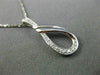 ESTATE .03CT DIAMOND 14KT WHITE GOLD 3D LOVE KNOT SEMI INFINITY FLOATING PENDANT