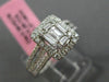 ESTATE LARGE .66CT ROUND & BAGUETTE DIAMOND 18KT WHITE GOLD HALO ENGAGEMENT RING