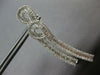 3.61CT DIAMOND 18KT WHITE GOLD 3D ROUND & BAGUETTE DOUBLE SWIRL HANGING EARRINGS