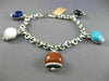 ESTATE LONG .81CT DIAMOND & MULTI GEM 14KT WHITE GOLD LUCKY BELL CHARM BRACELET