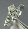 ESTATE WIDE 1.0CT ROUND DIAMOND 14KT WHITE GOLD TWO STONE CRISS CROSS LOVE RING