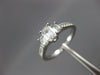 ESTATE .82CT DIAMOND PLATINUM THREE STONE EMERALD CUT FILIGREE ENGAGEMENT RING